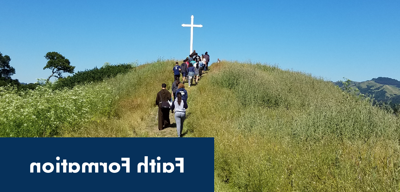 Image of students and a priest hiking up a hill with a white wooden cross at the top and the words "Faith Formation"